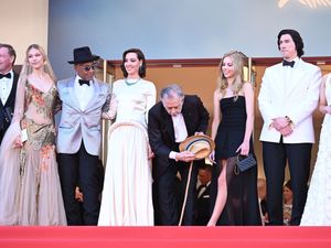 Supporting image for story: Francis Ford Coppola salutes the crowd at world premiere of Megalopolis