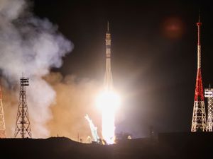 Supporting image for story: Craft carrying two Russians and an American docks at space station