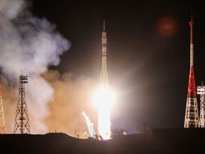 Supporting image for story: Craft carrying two Russians and an American docks at space station