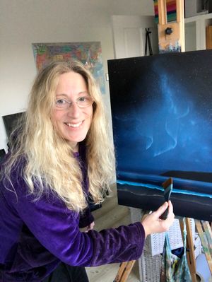 Finishing the bioluminescent wave her painting "Metamorphosis".