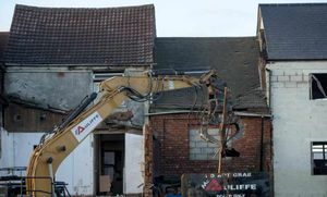 The demolition of derelict buildings in High Street, Bilston, as part of Urban village project