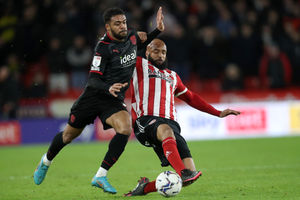 Darnell Furlong of West Bromwich Albion and David McGoldrick of Sheffield United during the Sky Bet Championship match between Sheffield United and West Bromwich Albion at Bramall Lane on February 9, 2022 in Sheffield, England. (Photo by Adam Fradgley/West Bromwich Albion FC via Getty Images).