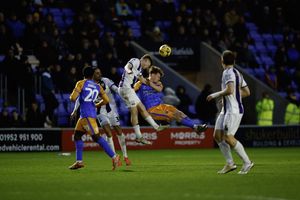 Tommy McDermott of Shrewsbury Town heads the ball during the game between Shrewsbury Town and Barnet