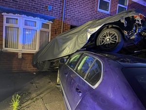 Supporting image for story: House left damaged as crash upends parked car