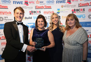 Anne Smith, managing partner and recently qualified Jordan Lewis from Harrisons Solicitors LLP with the Powys Business of the Year and People Development Awards and sponsors Councillor Glyn Preston from Powys County Council and Sara Clutton, representing NPTC Group of Colleges.