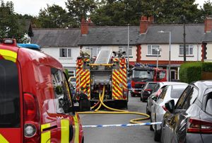 Fire crews remain at the scene of the fire in Dunsford Road, Bearwood.