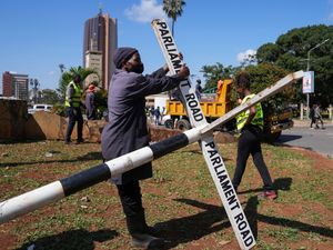 Supporting image for story: Kenyan authorities clear debris after protests which left at least six dead