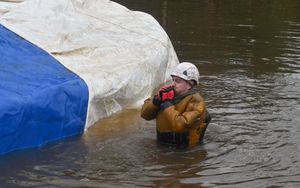 A worker in the water near the collapsed section of the Llangollen Canal on Tuesday. Photo: Steve Leath