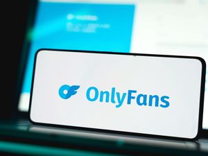 Onlyfans logo and website displayed on smartphone screen
