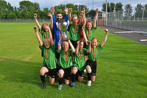 The winning girls' team from Trinity Primary School, near Ford, who represented Holland, with their trophy