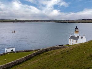 Supporting image for story: Man spotted clinging to hull of capsized vessel rescued