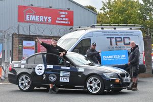 Richard Revins gives the thumbs up from his BMW which has been sponsored by Andy Carloman's Total Property Care to raise money for Diabetes UK. Mr Revins was joined by Mr Carloman, and his son Ryan, who is a Type 1 Diabetic.