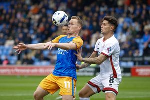 Anthony Scully of Shrewsbury Town and Gavan Holohan of Crawley Town