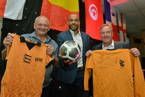 Former Wolves players Steve Kindon (left), Matt Murray (centre) and Steve Daley (right) show off the Wolves-themed raffle prizes. 