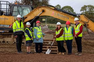 Councillor Heather Kidd, leader of Shropshire Council, presents a date stone to mark the beginning of a social housing development in Marton