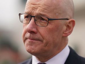 John Swinney pursing his lips