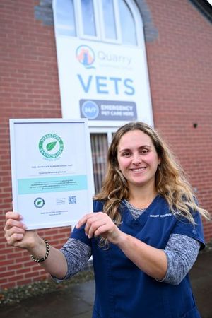 Vet Charlie Hertel with Quarry Vets' Green environmental award certificate. Photo: VetPartners