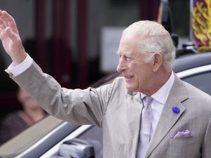 The King waving