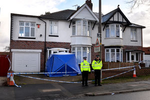 Police outside the couple's house on Moat Road, Oldbury