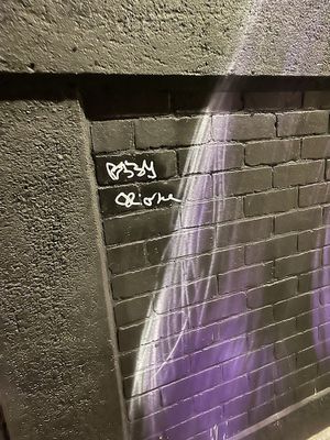 Ozzy Osbourne signs the Black Sabbath mural on Navigation Street in Birmingham