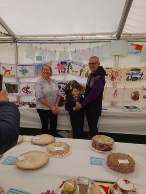 New Award in Children's Section for 2025 - The Michelle Davies Memorial Award for the best exhibit in the Primary School Age Classes went to Dewi Price with his Bug Hotel. Michelle's husband is making the presentation with Steward, Julie Evans.