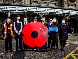 Supporting image for story: Giant poppy installed at Shrewsbury railway station