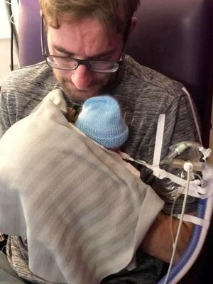 Rebecca Walker's partner David Brindley and baby Charlie-Jay. Photo: SWNS