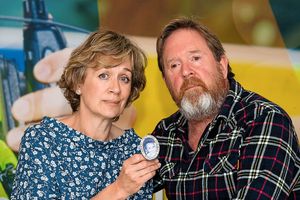 Beverley Brindley and Mark Brindley holding a photo of James when he was a baby.