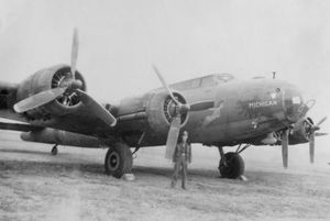 Michigan man John Hormuth poses with a mighty B-17 named "Michigan" at Atcham airfield in June or early July 1944
