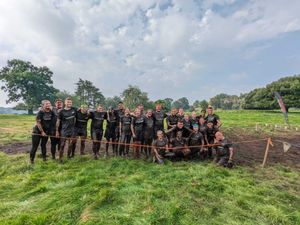 Supporting image for story: Darwin Group face mud, sweat and tears for fantastic cause