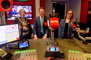 Mayor of Dudley Sue Greenaway and West Midlands Mayor Andy Street pose with Hannah Udall inside one of the broadcast studios