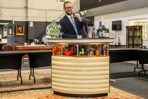 Will Farmer of Fieldings Auctioneers, with Del Boy's bar from Only Fools and Horses which is up for auction in Stourbridge, West Midlands.