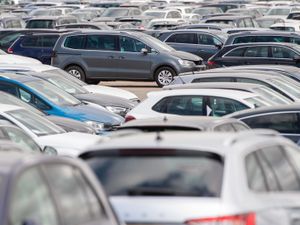 Cars lined up at a site in Corby