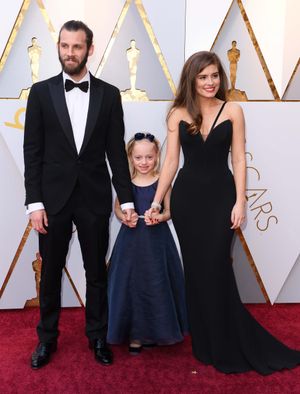 Cannock film director Chris Overton and screenwriter and actress Rachel Shenton with, centre, Maisie Sly on the red carpet. Picture: David Fisher/REX/Shutterstock