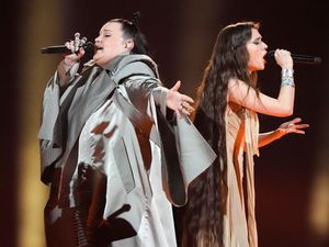 Supporting image for story: Eurovision acts perform as protesters shout at fans coming into arena
