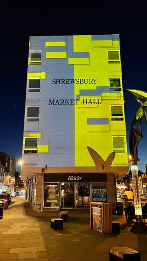Andy McKeown's light installation, displaying the colours of the Ukrainian flag on Shrewsbury Market Hall
