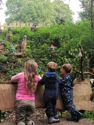 children looking at the fairy village