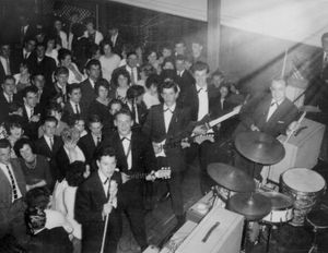 The Deltas during the concert, with Roger third from left in the group line-up.