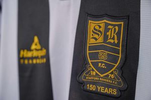 The new Stafford Rangers home shirt features a gold badge and details as the club will celebrate its 150th anniversary in 2026. Picture via: Stafford Rangers/Jamie Maaskant. 