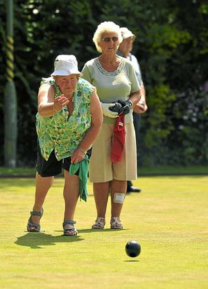 Bowling is Elizabeth Mumford, watched by Vera Hodgetts