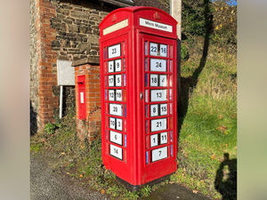 Supporting image for story: 'We took on our village phone box when BT decommissioned it - now it's an advent calendar'