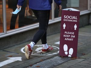 Supporting image for story: Face coverings and social distancing may last for years to come, says expert