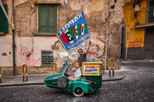 Founders Thom and James with a vespa in Naples