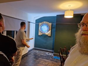 The darts room upstairs was busy with a full game going