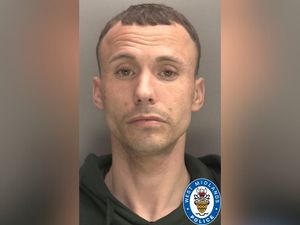 Supporting image for story: Police issue picture of man wanted over Dudley robbery