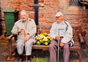 Ron and Roy Tomlin on the memorial bench in Ford dedicated to their mother Florence and sisters