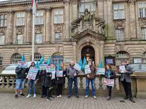 Staff from Elmwood School took their protest to the town hall.