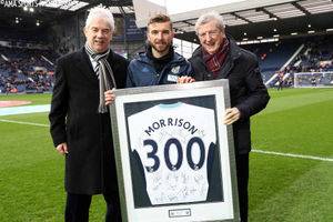 James Morrison of West Bromwich Albion is presented with a framed and signed 300 appearances shirt by former West Bromwich Albion manager Roy Hodgson and John Williams Chairman of West Bromwich Albion