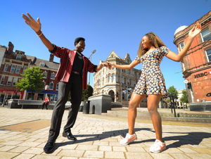 Britain’s Got Talent Wiggle Wine singer, Donchez Dacres, dances with his daughter Leannah Dacres, in Queen Square