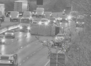 Three lanes of four have closed on the M5 following a collision, resulting an a lorry overturning on the motorway